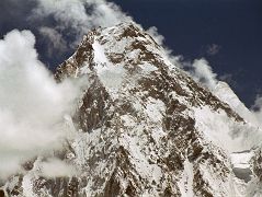 
Gasherbrum II pokes out to the right of The West Face of Gasherbrum IV shining in the late afternoon sun from Concordia.
